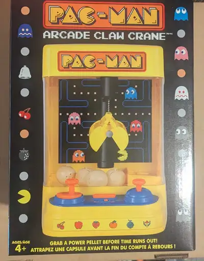 Relive arcade nostalgia with this Pac-Man Arcade Claw Crane! This machine is brand new in original p...