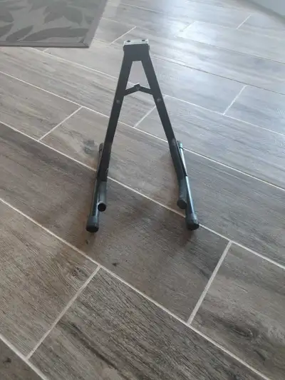 This is a used guitar stand perfect for displaying your instrument securely. It's in good condition...