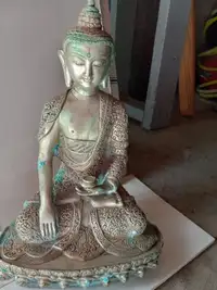 antique silver buddha statue