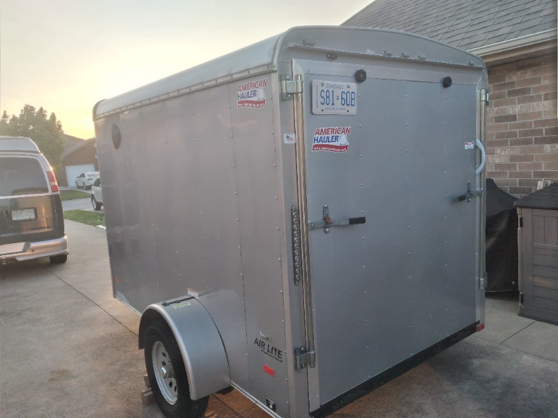 Trailer Enclosed 6X10 ramp and side door like new 5500.00 Cargo