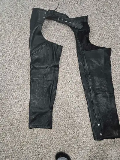 Used once Leather motorcycle chaps. Inseam is 26", overall length is 36" waist is adjustable. In exc...