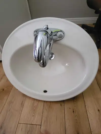 Kohler sink with Moen faucet and drain, View more