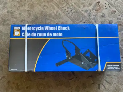 New still in the box motorcycle wheel chock. Purchased to build a trailer that was not completed.