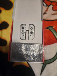 Totally brand new nintendo switch oleg with two games 