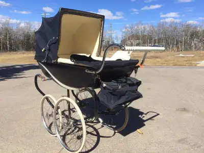 Vintage silver cross baby stroller in navy blue colour. All parts are functioning. The rubber on the...