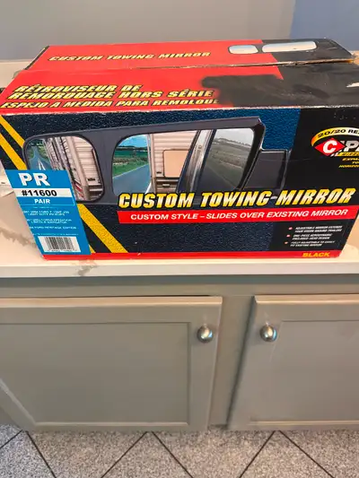 Brand new in box. Slides over existing mirror.