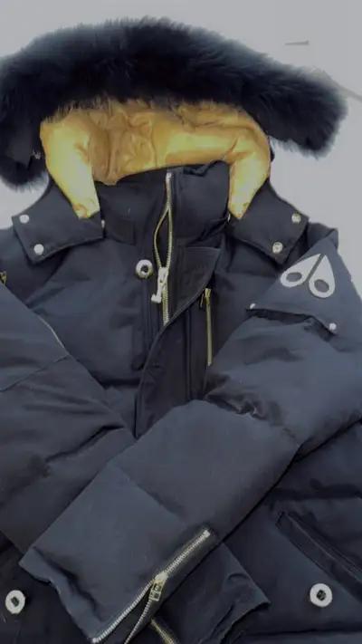 This is a Moose Knuckles down-filled parka, designed to keep you warm and stylish in the coldest wea...