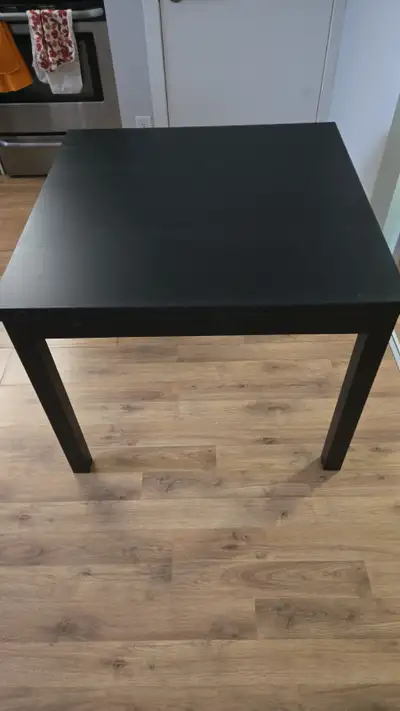 Black wooden table purchased from Structube. The table is solid and in good condition, folds out to...