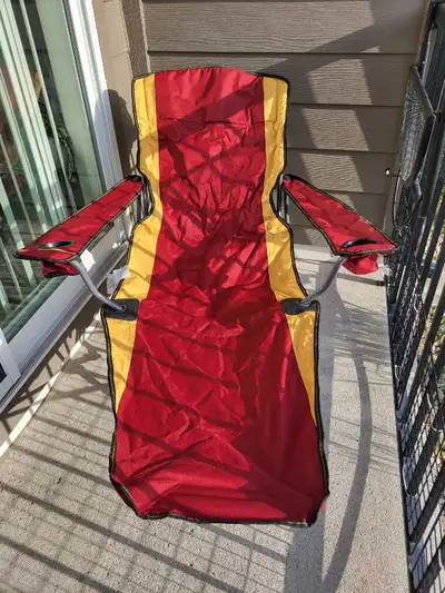 Red & Yellow Camping Chair w/Footrest Lounger $15 Mesh storage pocket on the back Two cup holders Ca...