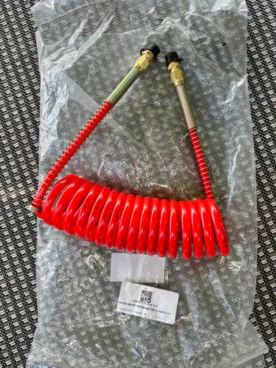 15' Coiled Air Line - Red (Emergency) air line. NEW 1/2" O.D. reinforced nylon tubing lines feature...