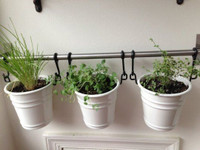 IKEA fintorp rail with hanging white baskets
