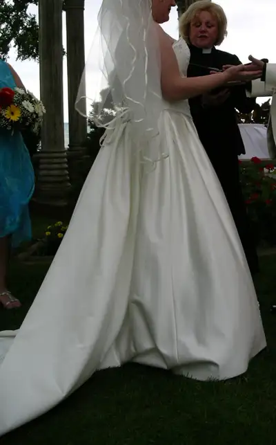 Wedding dress - off white. Small train. Corset with privacy panel if you like. Can be hemmed (or let...