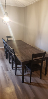 Large 9 foot solid wood dining table with 6 chairs and a bench