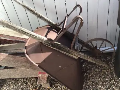 vintage wheelbarrow $50.00. Pick up only. Vintage dolls: giraffe dress doll $3.00. Red hat doll $4.0...