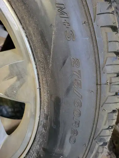 1 Cooper discoverer tire with rim.