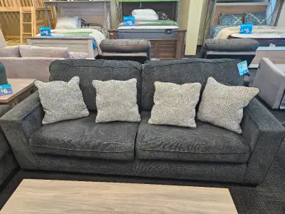 Slate gray chenille-feel upholstery Sleek track arms Plump cushioning Decorative pillows included Fr...