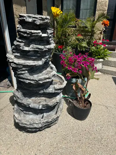 Garden/Deck Fountain made of resin, 8 tiers, with lights, 58" high, base 28" wide. Comes with the pu...