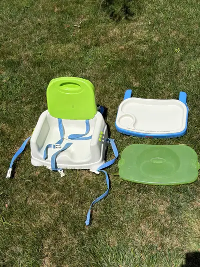 As shown. Toddler portable booster seat with tray, tray cover and safety straps. Like new. $30 obo C...