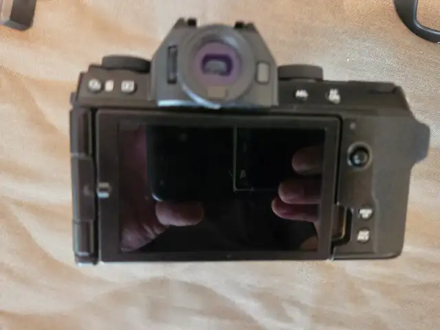 Fujifilm X-S10, 18-135mm WR lens, extra battery, filters $169562864363968386121