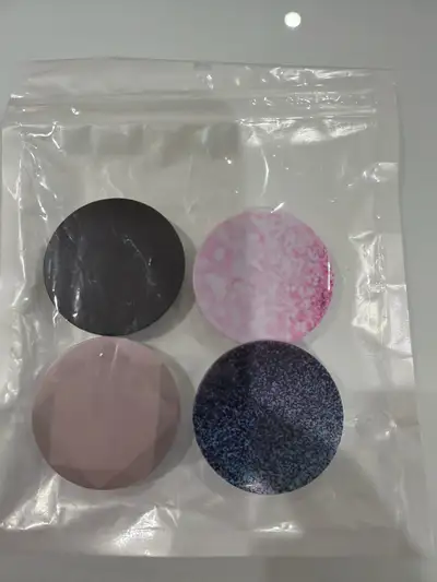 I'm offering a set of four brand new Popsockets, still sealed in their original packaging! These han...