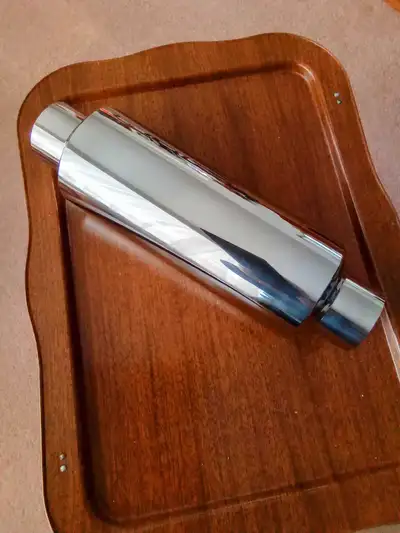 New hi Performance polished stainless steel mufflers. They are for a 2 1/2 inch pipe and are 14 inch...