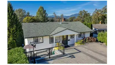 Backing onto Colony Farm Regional Park, this stunning fully renovated upper-level home (2024/2025) o...