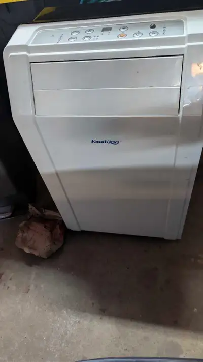 Portable AC unit with window vent. 12,000 BTU. In perfect working order.