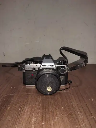 Description: Key Features: Lens Mount: Olympus OM mount, compatible with a variety of Zuiko lenses....