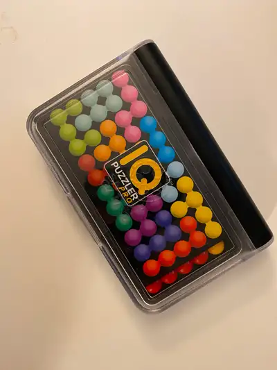 CHOKING HAZARD -- Small parts. - This travel-friendly puzzle game comes with a double-sided game boa...