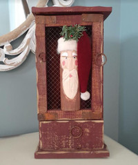 Rustic looking table top cabinet with Santa Claus & chicken wire