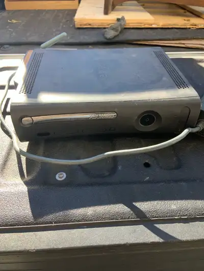 Read the entire ad. Xbox 360 console, adapter, Plus two broken headsets. ( they are free with sale)...