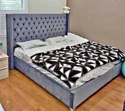 This is a used queen bed frame featuring a stylish, tufted headboard that adds a touch of elegance t...