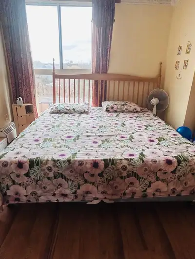 Hardly Used King size 9 inch mattress with 2 big box springs. An Iron frame & Wooden headboard. Ever...