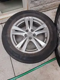 Four Michelin tires  on rims from Hondas in good condition 