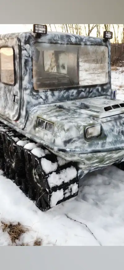 8 wheel Argo. New tires. Comes with tracks. Great for hunting. New carburetor.