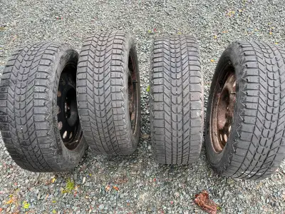 Firestone Winterforce tires (225/60R18) on rims with 6mm tread depth.