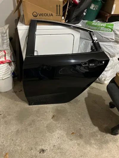 2020 Honda civic LX Black driver side rear door (passenger). Slightly dented