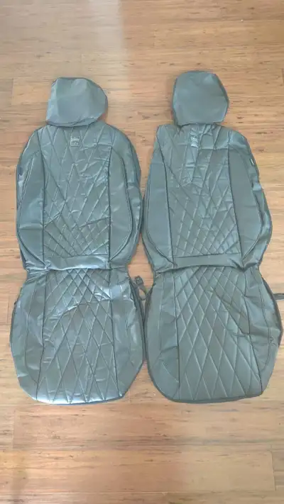 These stylish black car seat covers feature a quilted design and are in excellent condition, ready t...