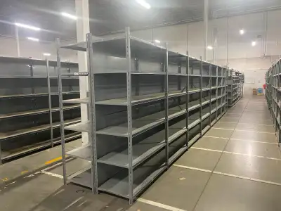 Used strong metal shelving units for sale! 24” deep x 48” wide x 7’4 tall. Chip e of Solid end panel...