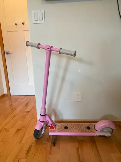 Kids Pink E-Scooter in great shape, great price! Very fun to ride, foot-operated by stand-on buttons...