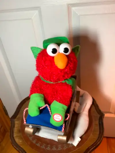 Sesame St Elmo Singing a Holiday Tune on His Rocking Sleigh, View more