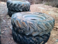 4 GRADER TIRES AND RIMS 14 : 00 X 24 THEY ARE FILLED SOLID TIRES