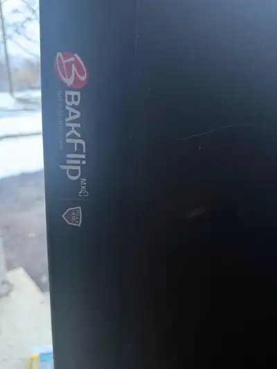 Bakflip MK4 flush mount tonneau cover came off a 2008 gmc 1500 with a 6.5 foot box. It has one dent...