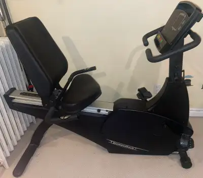 Recumbent exercise bike, heavy-duty, gym-quality build with smooth magnetic resistance and self-gene...