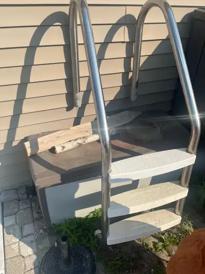 Used stainless steel pool ladder, 3 step, rubber caps on feet, not needed anymore. Complete and read...
