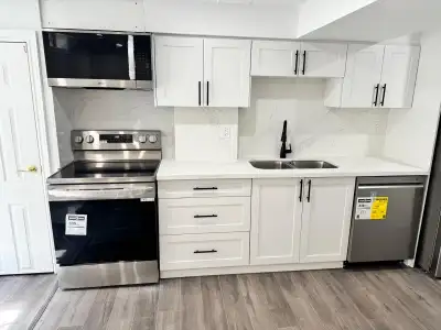 Bright & Spacious 2-Bedroom + Den Legal Basement Apartment