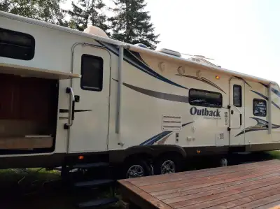2012 Outback , 4 season travel trailer. It has 2 slides, front bedroom , rear bunk house and outdoor...