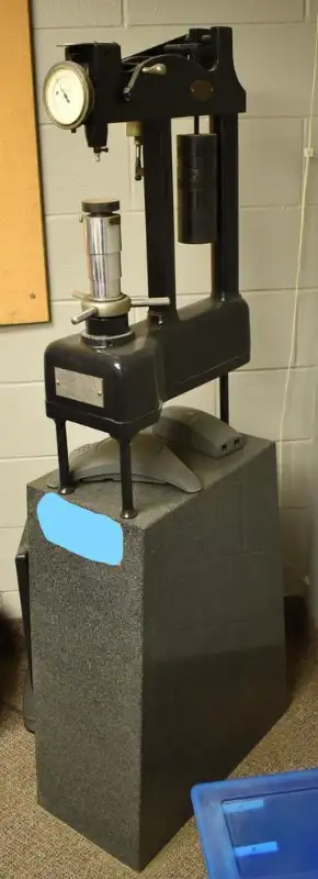 Rockwell hardness tester , with weights and metal stand, View more