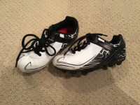 SIZE 11 ATHLETIC WORKS BRAND BLACK AND WHITE CLEATS