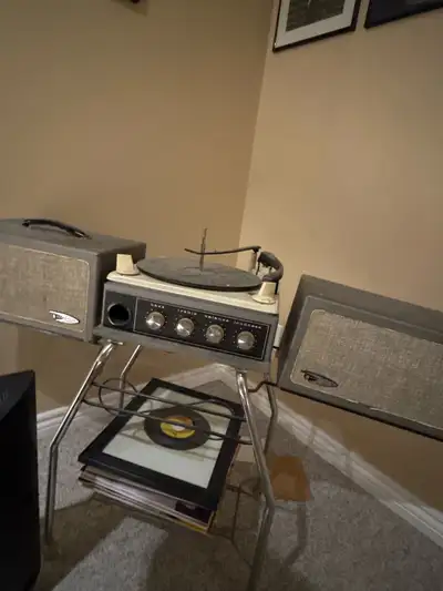 Relive the golden era of music with this vintage Electrohome record player! This used record player...